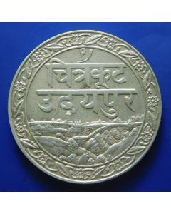 India - Princely States – Mewar,	 Fatteh Singh	 Rupee	1928	  Silver – (thick legend) ૧૯८५ 